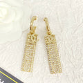 CC TEXT DIAMOND PAVED LIGHT GOLD DROP EARRINGS