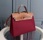 HM HERBAG ZIP 31 WINE RED AND COPPER CANVAS