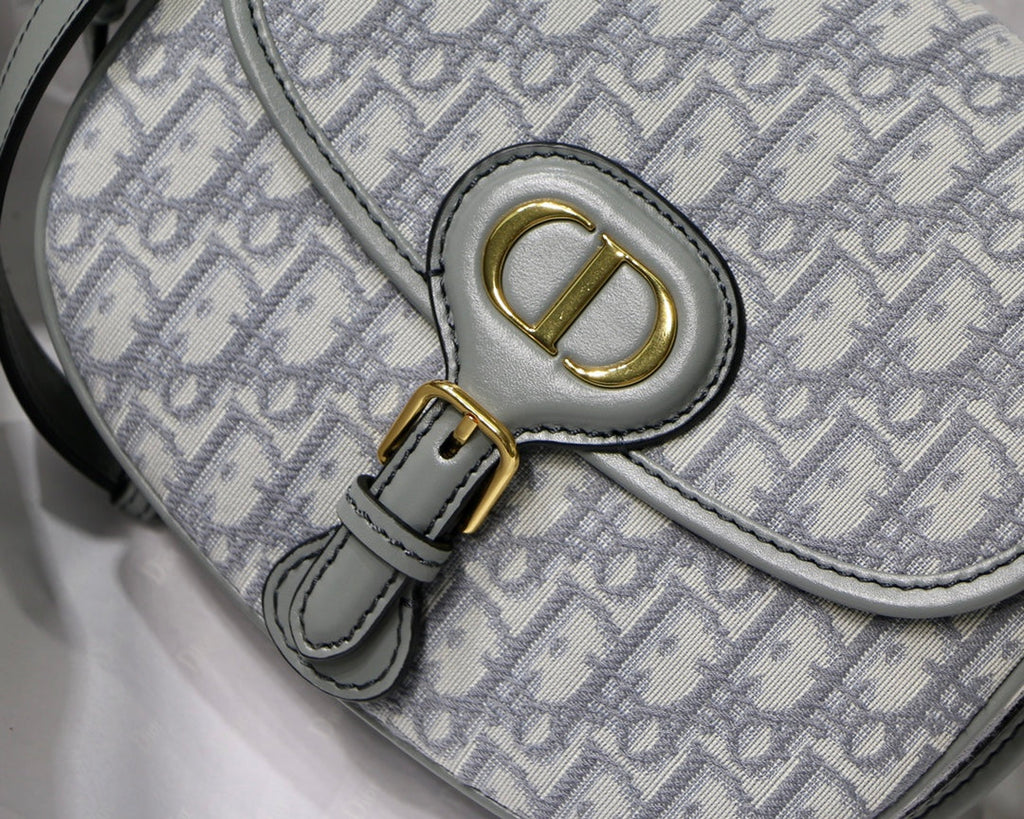 MEDIUM CD BOBBY 22CM GREY OBLIQUE CANVAS GOLD HARDWARE