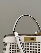 PEEKABOO ISEEU 34 IN WHITE PERFORATED CALFSKIN GOLD HARDWARE