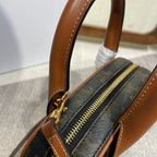 TOP HANDLE BAG 20 IN BLACK TRIOMPHE CANVAS AND BROWN CALFSKIN