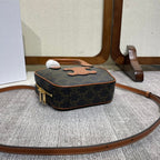 TOP HANDLE BAG 20 IN BLACK TRIOMPHE CANVAS AND BROWN CALFSKIN