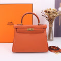 HM KELLY BAG 25 ORANGE TOGO GOLD HARDWARE