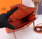 HM KELLY BAG 28 ORANGE TOGO GOLD HARDWARE