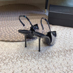 HIGH SLINGBACK IN BLACK GLOSSY CALFSKIN SPLICED WITH TPU