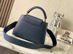 capucines bb 27 midnight blue taurillon leather gold hardware