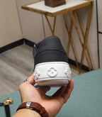 LV TRAINERS IN BLACK CALFSKIN AND MONOGRAM CANVAS
