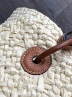 Medium anagram basket bag in iraca palm and calfskin