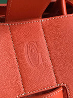 SAIGON SOUPLE BAG 34 IN RED ORANGE GOYARDINE CANVAS AND CALFSKIN