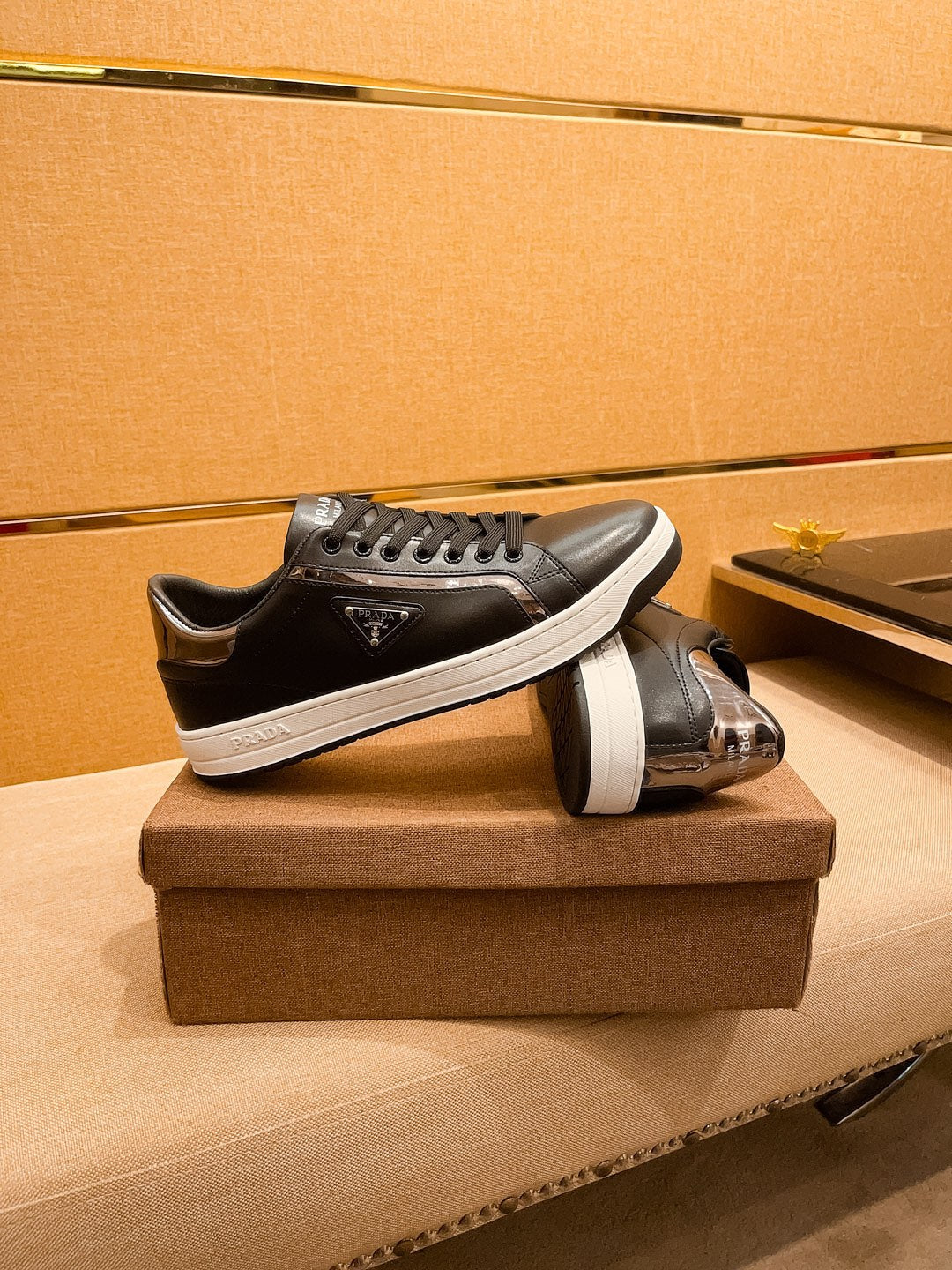 PRA SNEAKER IN BLACK CALFSKIN WITH GLOSSY GOLDEN