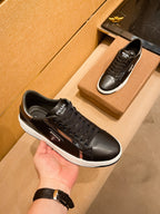 PRA SNEAKER IN BLACK CALFSKIN WITH GLOSSY GOLDEN