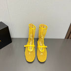 ALAIA SHORT BOOTS IN LEMON YELLOW MESH FISHNET