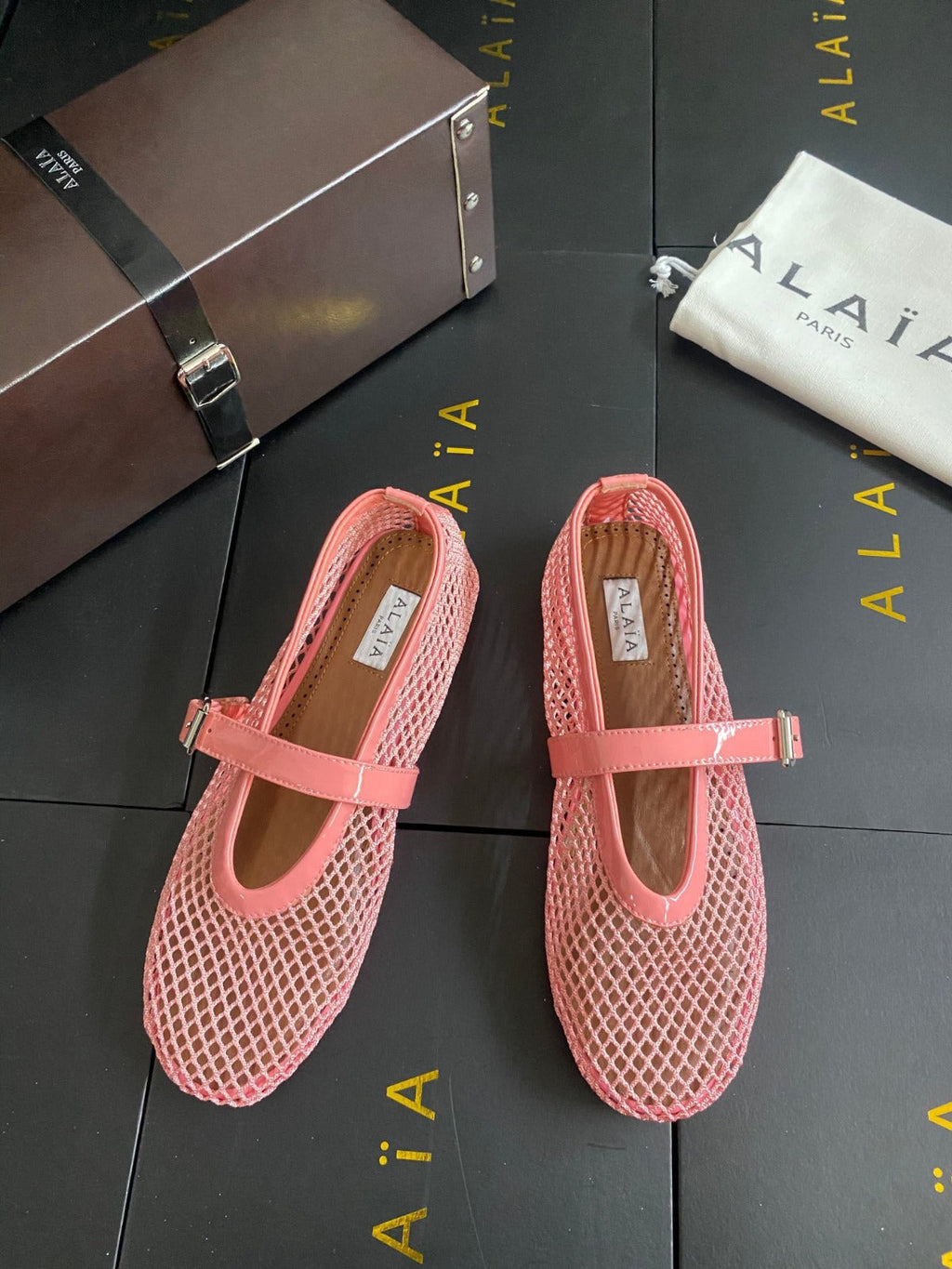ALAIA BALLET FLATS IN LIGHT PINK MESH FISHNET