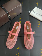 ALAIA BALLET FLATS IN LIGHT PINK MESH FISHNET