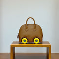 HM Bolide Mini 19cm Gold Epsom Leather on Yellow Wheels