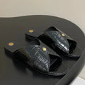 FLAT SLIPPERS IN BLACK CALFSKIN SNAKE EMBOSSING