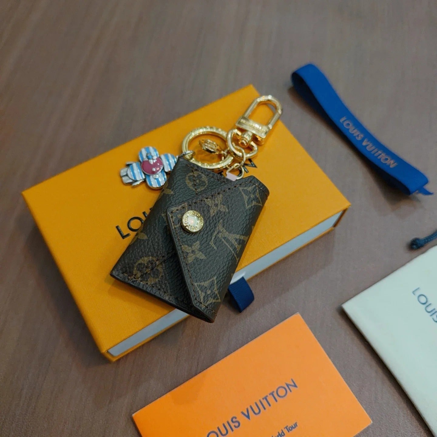 LV Brown Bag Charm With Blue Flower