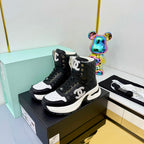 Chanel 2025 Quilted High-Top Sneakers Black White Cowhide 469789