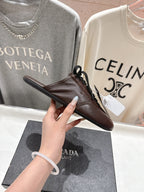 Prada 25s mule dark brown sheepskin 535501