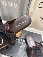 Prada 25s mule dark brown sheepskin 535501
