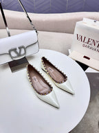ROCKSTUD FLAT PUMP IN WHITE CALFSKIN