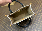 onthego pm 25 cream monogram empreinte embossed calfskin bagcharm