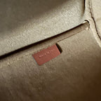 CLARA BAG 24 IN BLACK TRIOMPHE CANVAS AND BROWN CALFSKIN TRIM