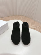 SNOW ANKLE BOOTS IN BLACK SHEARLING