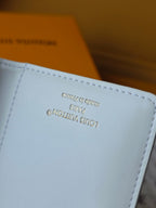 M25601 Lou Wallet 11.5cm Dream Beige Monogram Embossed Lambskin- Light GHW