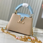 capucines nano 16 beige cloud blue taurrilon leather gold hardware