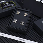 TWISTED ROPE STUD EARRINGS IN METAL WITH WHITE PEARLS