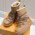ASPEN PLATFORM ANKLE BOOT IN CIDER BROWN MONOGRAM DEBOSSED SUEDE AND SHEARLING