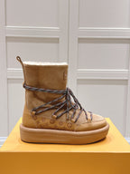 ASPEN PLATFORM ANKLE BOOT IN CIDER BROWN MONOGRAM DEBOSSED SUEDE AND SHEARLING