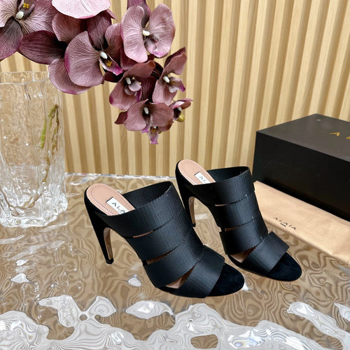 ALAIA ELASTIC CAGE MULE SANDALS IN BLACK WOVEN STRAP AND LAMBSKIN