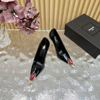 RED GEM-STUDDED HIGH PUMPS IN BLACK PATENT CALFSKIN