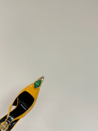 GREEN GEM-STUDDED SLINGBACK PUMPS IN YELLOW PATENT CALFSKIN