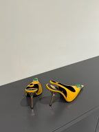 GREEN GEM-STUDDED SLINGBACK PUMPS IN YELLOW PATENT CALFSKIN