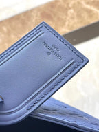 SAC PLAT 24H 41 IN SAPPHIRE BLUE MONOGRAM EMBOSSED TAURILLON