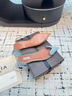 ALAIA FLAT SLINGBACK IN LIGHT BLUE PATENT CALFSKIN AND FILM