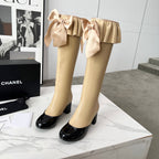 CC 25 high boots beige black sheepskin 459456