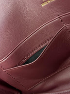 BEL AIR CLUTCH 27 IN BURGUNDY RED NAPPA LAMBSKIN GOLD HARDWARE