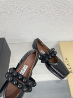 ALAIA MARY JANE PEARL IN GLOSSY BLACK LAMBSKIN