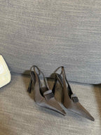 POINTED-TOE SLINGBACK PUMPS IN BLACK SILK