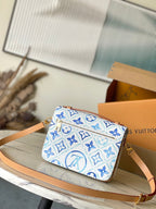 POCHETTE MÉTIS 25 IN LAGOON BLUE MONOGRAM TILES CANVAS GOLD HARDWARE