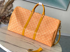 KEEPALL BANDOULIÈRE 55 IN ORANGE MONOGRAM HERITAGE CANVAS