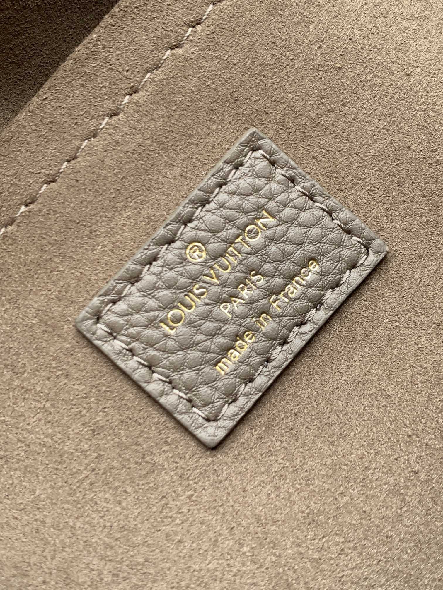 LV M25904 Hand It All PM Taupe Perforated Mahina Calfskin