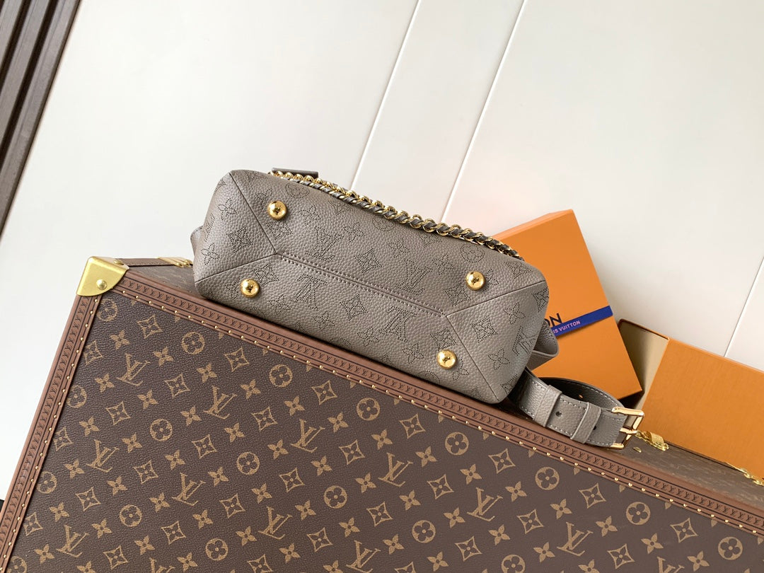 LV M25904 Hand It All PM Taupe Perforated Mahina Calfskin