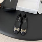CC 26K Bow Ballet Flat Black Lambskin Canvas 670830