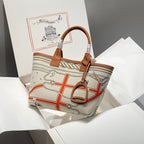 STEEPLE 28 BAG IN BEIGE CANVAS AND BROWN SWIFT LEATHER