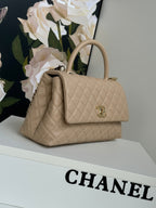 coco handle medium 29cm beige quilted caviar leather gold hardware